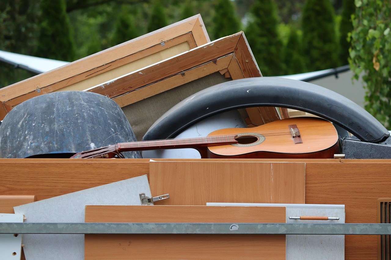 Furniture and appliances piled up for bulk trash pickup - Blanco's Hauling and Handyman Service in San Bernardino